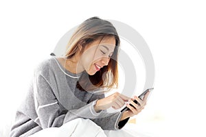 Young asian woman using smart phone with relax emotion on white