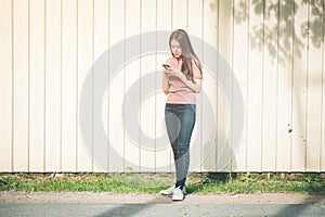 Young asian woman using smartphone