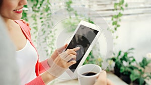 Young Asian woman using tablet with her husband