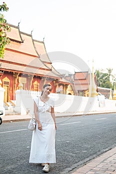 Young Asian Woman at Wat Sene Souk Haram ,Luang Prabang, LAOS