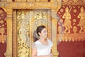 Young Asian Woman at Wat Sene Souk Haram ,Luang Prabang, LAOS