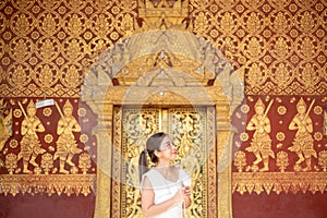 Young Asian Woman at Wat Sene Souk Haram ,Luang Prabang, LAOS