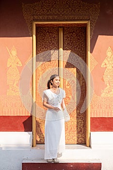 Young Asian Woman at Wat Sene Souk Haram ,Luang Prabang, LAOS