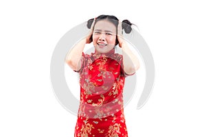 Young Asian woman wearing chinese dress cheongsam with shocked facial expression. Portrait of surprised beautiful girl