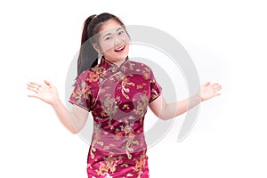 Young asian woman wearing chinese dress traditional cheongsam with gesture of congratulation,