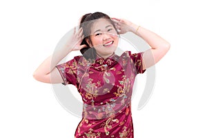 Young asian woman wearing chinese dress traditional cheongsam with gesture of congratulation,