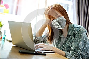 Young asian woman wearing mask protect covid-19 feeling strain fatigue