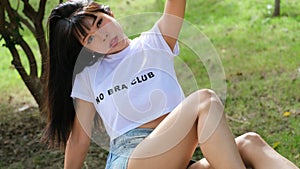 Young Asian woman wears unbranded white t-shirt