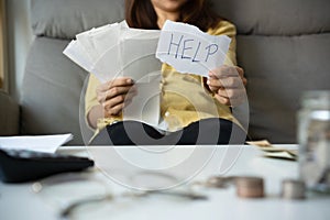 Young Asian woman worried need help in stress at home, accounting debt bills bank papers expenses and payments feeling desperate