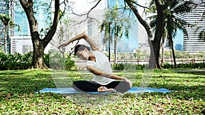 Young asian woman yoga outdoors keep calm and meditates while practicing yoga to explore the inner peace.