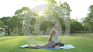 Young asian woman yoga outdoors keep calm and meditates while practicing yoga to explore the inner peace.