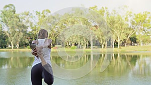 Young asian woman yoga outdoors keep calm and meditates while practicing yoga to explore the inner peace.