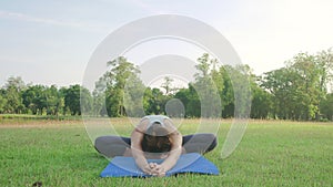 Young asian woman yoga outdoors keep calm and meditates while practicing yoga to explore the inner peace.