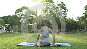 Young asian woman yoga outdoors keep calm and meditates while practicing yoga to explore the inner peace.