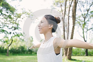 Young asian woman yoga outdoors keep calm and meditates while practicing yoga to explore the inner peace.