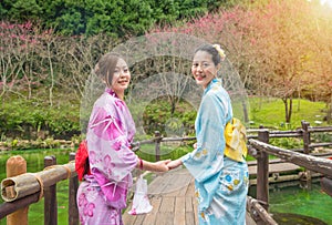 Young asian women dress kimono near lake