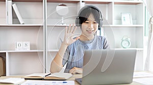 Young Asian women are greeting friends and teachers through video chats and greeting them with cheerful expressions