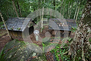 Young Asian women traveler with white umbrella at Political and Military School, Phu hin Rong Kla National Park, Phitsanulok, Thai