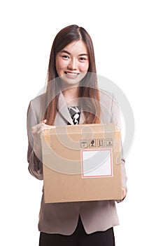 Young Asian working woman with 3 heavy shipping boxes.