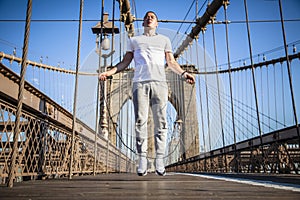 Young athlete jumping rope on Brooklyn Bridge