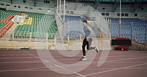 Young athlete leaping over barriers.Slow Motion