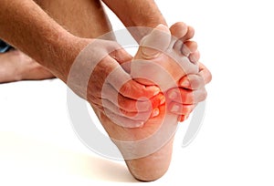 Young athlete male holding his foot got injury from Exercise or training.