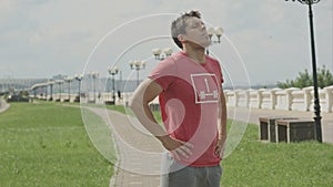 Young athlete man doing stretching warming up before jogging outdoors