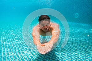 Young athlete man in swimming pool. Swim exercise