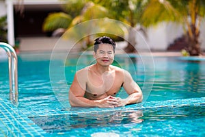 Young athlete man in swimming pool. Swim exercise