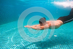 Young athlete man in swimming pool. Swim exercise