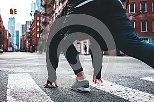 Young athlete preparing to running start