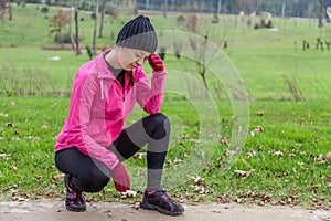 Young athlete woman feeling lightheaded or with headache