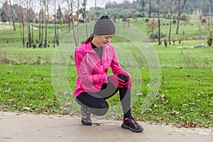 Young athlete woman hurting from a knee injury