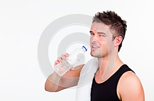 Young Athlethic man drining water