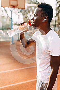 A young athletic African American relaxes after an intense workout