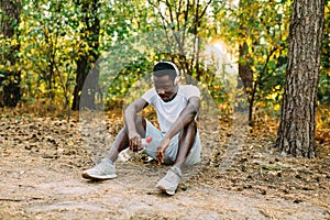 A young athletic African American relaxes after an intense workout