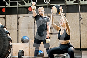 Couple training in the crossfit gym photo