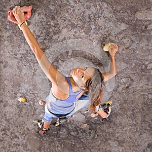 Young, athletic girl climbing