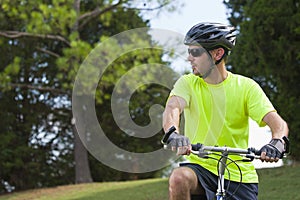 Young athletic man on bicycle