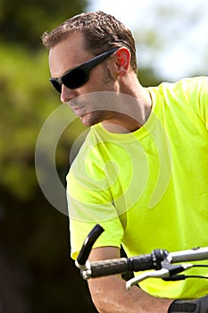 Young athletic man on bicycle