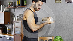 Young man drinking a smoothie drink or a protein shake