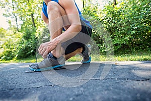 Young Athletic Man Tying His Shoelace