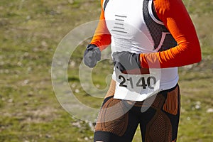 Young athletic runner on a cross country race. Outdoor circuit