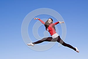 Young athletic woman jumping