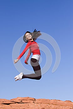 Young athletic woman jumping