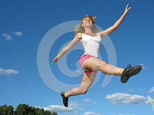 young athletic woman in a long jump