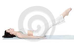 Young athletic woman performing exercises to strengthen the press .isolated on white