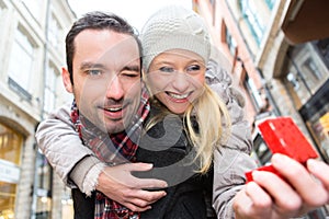 Young atractive man offering ring to his wife