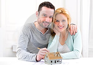 Young attractive 30s couple making home project