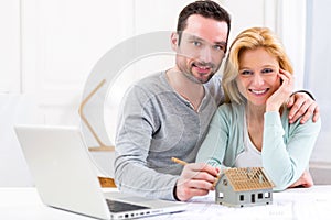 Young attractive 30s couple making home project